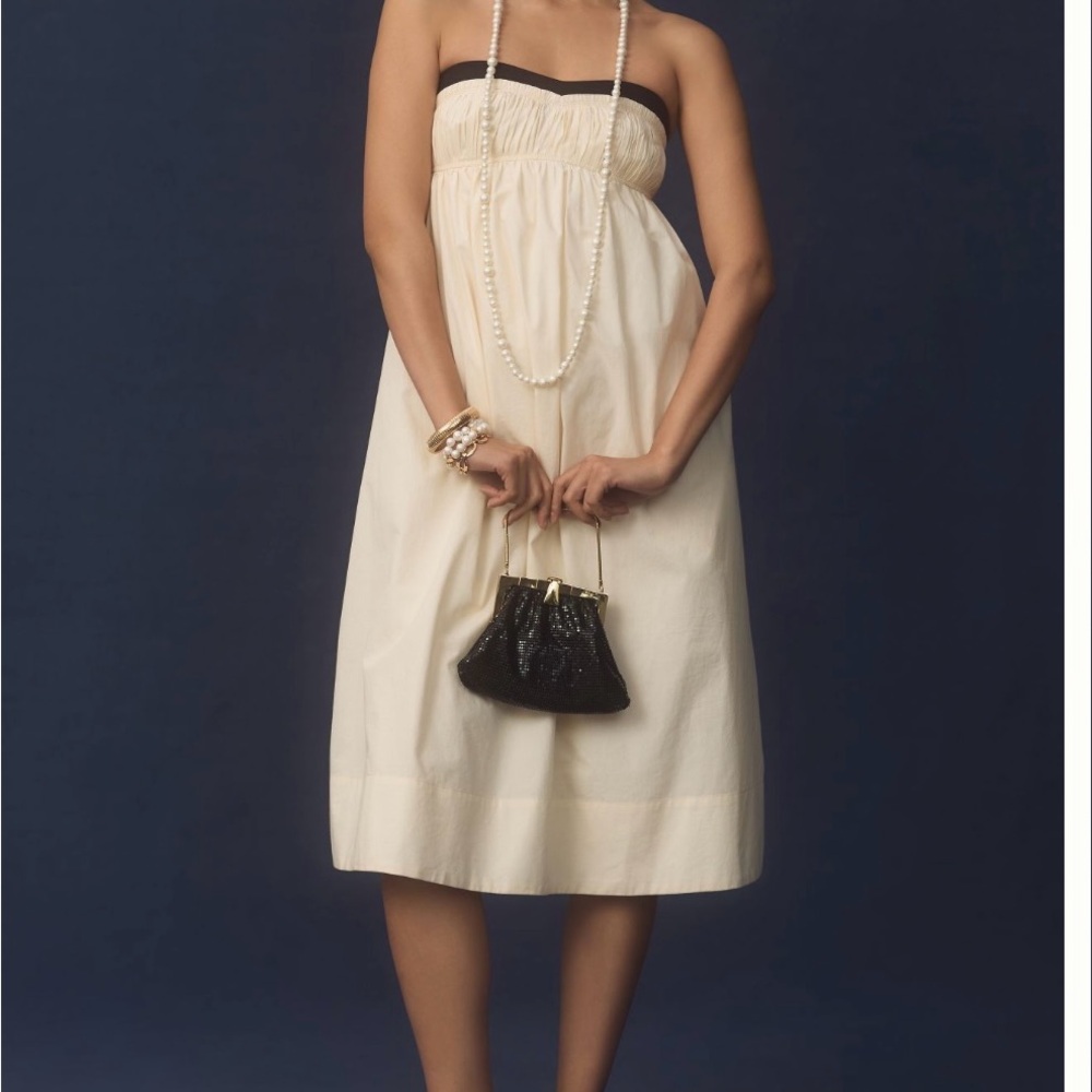 Maeve Strapless Pintuck Open-Back Dress. Color is Ivory with Black bodice trim.